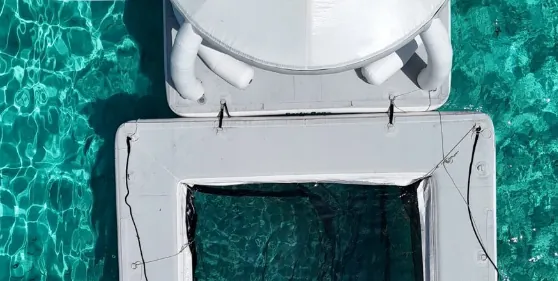 Aerial view of the yacht deck over turquoise water