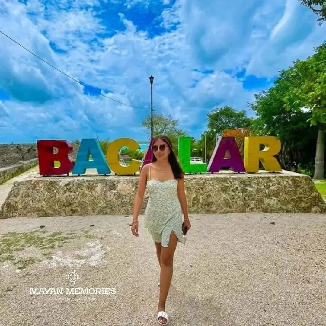 Woman in front of the colorful Bacalar letters
