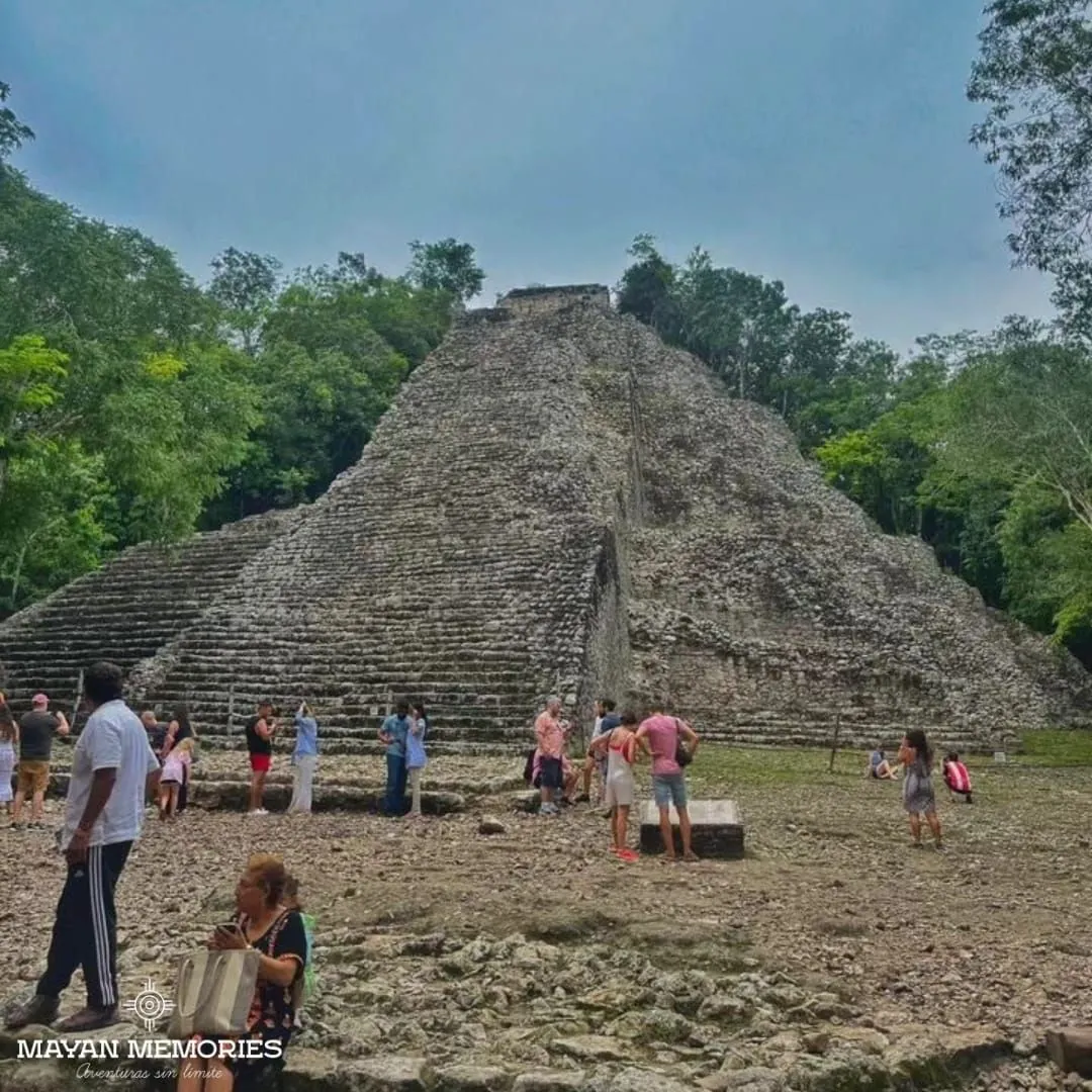 Nohoch Mul pyramid in Cobá with visitors at its base