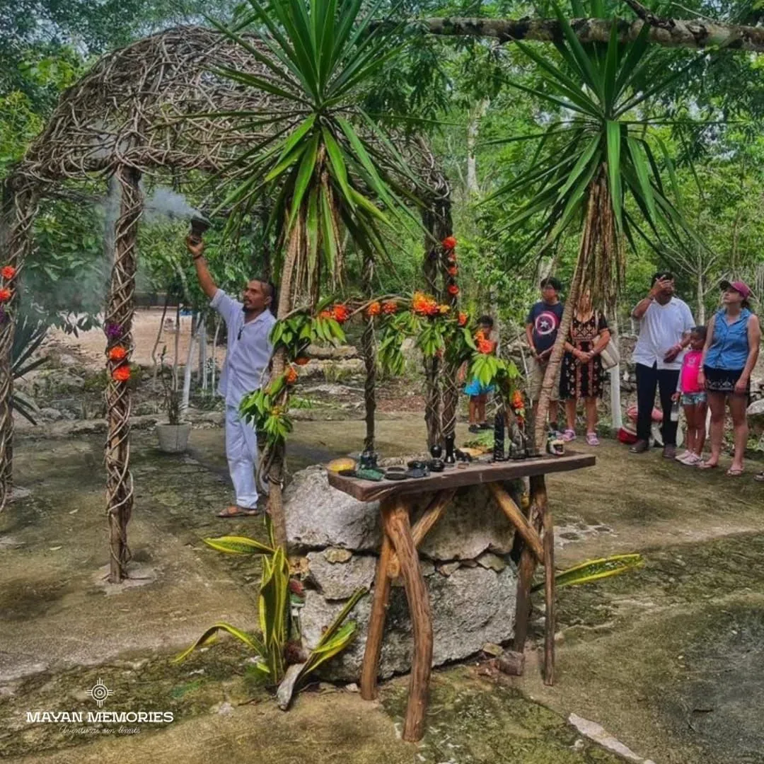 Dancers in Mayan dress in a jungle clearing