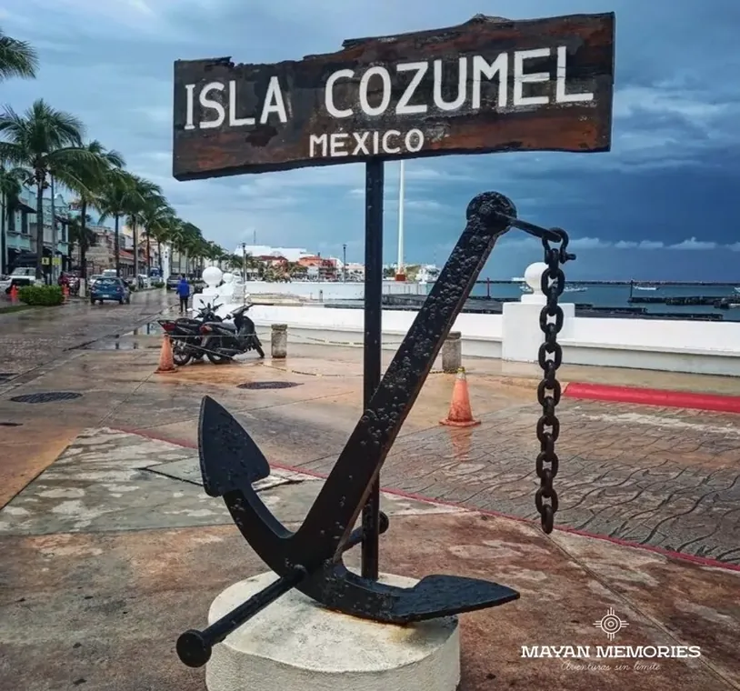 Anchor monument and Isla Cozumel sign on the waterfront