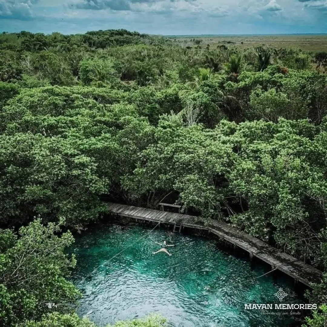 Aerial view of Yalahau cenote surrounded by mangroves