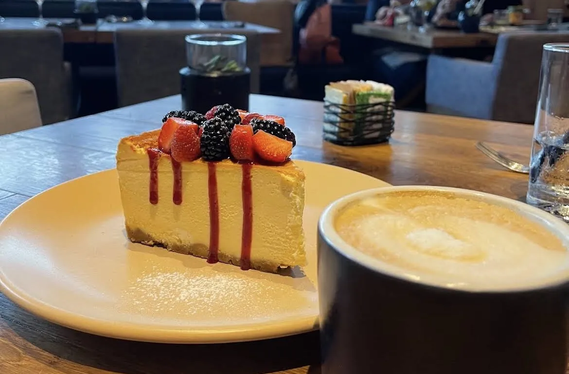 Cheesecake with berries and a coffee