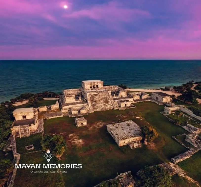 Aerial view of the Tulum archaeological site by the sea at sunset