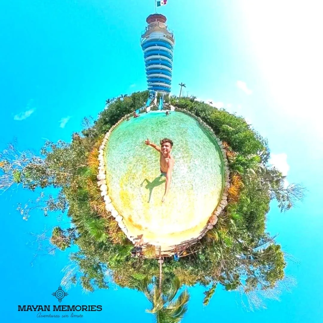 Circular view of a visitor jumping into the water in the jungle